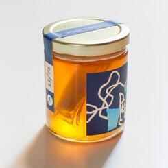 Honey in USB format submerged in a jar of raw honey