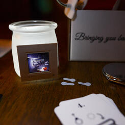 The Institute for Counterfeit Memory set illuminated by tiny lights