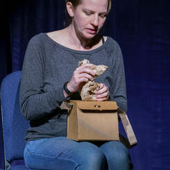 Muffin Ears: sitting with squirrel and purse.