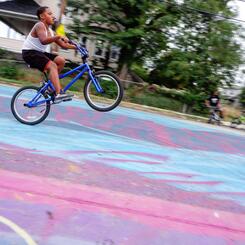 Pimlico student wheelie on Horizontal Mural