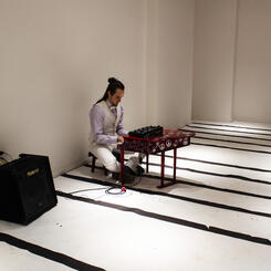 Musician Benjamin Buchanan performing at closing reception