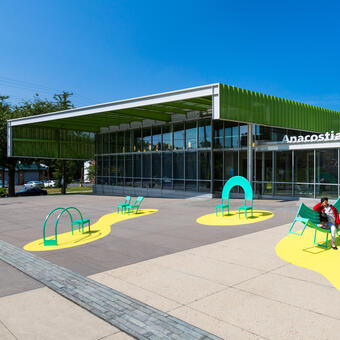 The Chairs sculptural seating public art installation in Washington DC. Each of the eight custom chairs and benches encourages interaction and offers unique opportunities for play and social engagement.