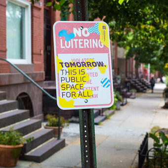 Tomorrow, this is public space for all. A disrupted No Loitering sign public art piece