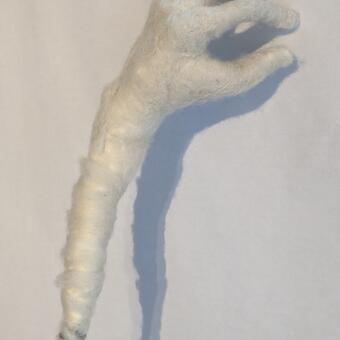 Close up of needle felted hand using tree branch as armature approx. size of hand 8"x6"x3"