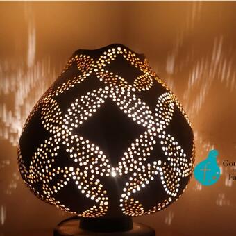 The Patterns Gourd Lamp was made to celebrate geometric patterns. It projects overlapping circular shapes that repeat till they form other geometric shapes.