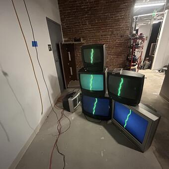 Electric Body - When you touch the chord you activate the signal on the CRT tv's manipulating it in real time with your body completing a circuit.  The TV's are abandoned / found from areas in and around Baltimore that I repurpose in this interactive installation