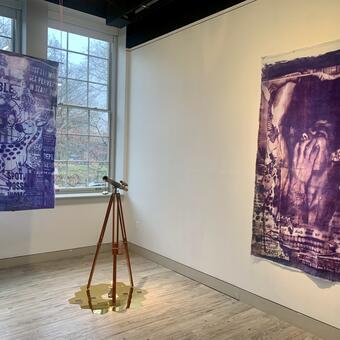 Two lavender textiles and a telescope 