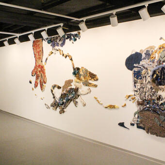 installation view of exhibit and wall piece, "Magical Thinking