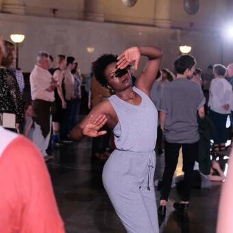 Trustina Sabah in a dance pose during "Mass Rabble", a theater production By Submersive Productions