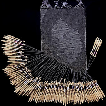 A bobbin lace portrait of a woman's face. 