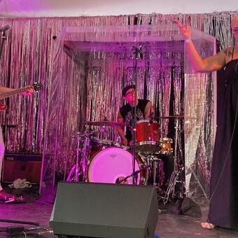 Left to right, Dominique Diglio (guitar), Andrea Shearer (drums), and Rahne Alexander (vocals) appear on the Current Space stage during Summer ATP. 