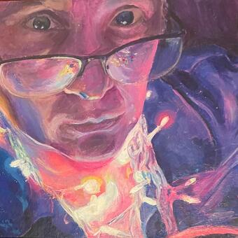 figure wrapped in lights