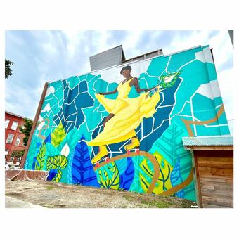 woman stands in front of baltimore map on skates