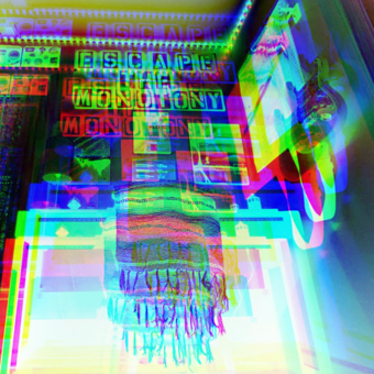 photograph that has overlays of the same image in green, red, and blue of an art space with a sign at the top that reads "Escape the Monotony"