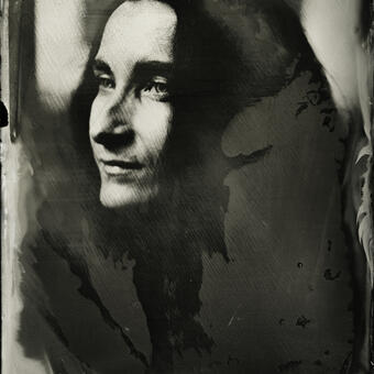 A wet plate collodion portrait of a woman with black hair in 3-quarter view