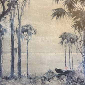 This is a lithograph in mostly cream and green-grays, depicting a shoreline, waterline, and sky framed by tall palm trees with Spanish moss dripping from the limbs. Near the shoreline, slightly to the right of center, a small rowboat rests in the water. In the boat is a fisherman wearing a very faded red shirt.