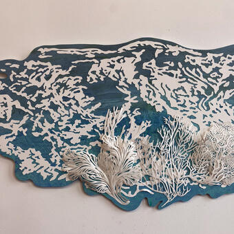 Ghost Coral 1 - 2024, Wood, paper, acrylic, 25.5” x 43” x 2” Shaped wood background with intricately cut out dimensional images based on water currents, all from paper.