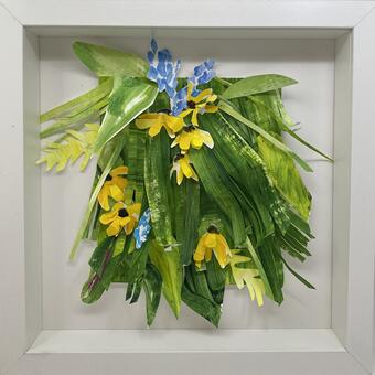 Protruding green foliage, yellow coreopsis, blue lariope 