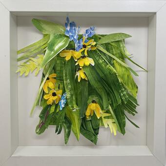 Protruding green foliage, yellow coreopsis, blue lariope 