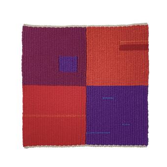 Tapestry weave using red and purple colors wool yarn in various blocks. 