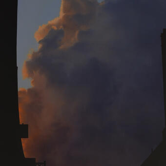 painting of a highway overpass silhouetted against the sky