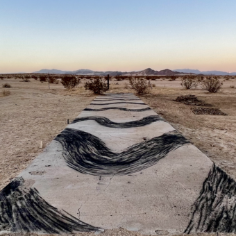 View of charcoal drawing on concrete slab of changing Arctic jet stream patterns 