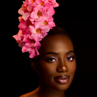 BLOSSOMING - In this evocative piece, I juxtapose a beautiful Black woman with a vibrant flower, merging my deep appreciation for Black beauty with my agricultural background. The portrait captures the woman's essence in a uniquely simple yet powerful way, celebrating the natural radiance and depth that have always captivated me. The flower represents life's journey—from bud to bloom—mirroring human development while symbolizing grace, resilience, and transformation. 