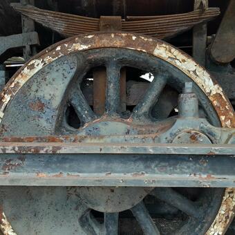 An old train engine rusted wheel