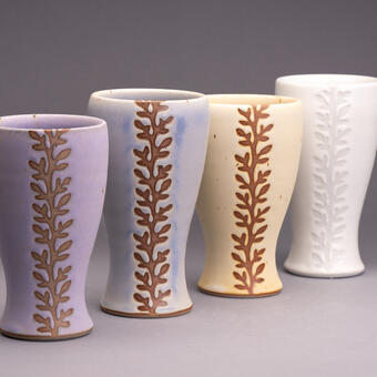 Four ceramic tumblers, high fired in cone 10 reduction, materials are stoneware, porcelain and glaze.