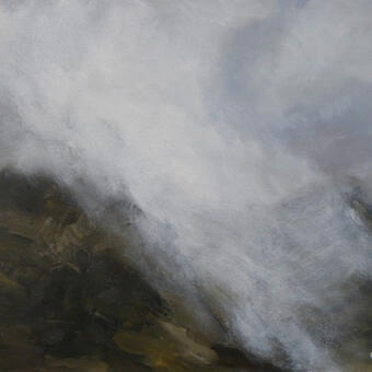 Mountain range in Scotland with mist descending