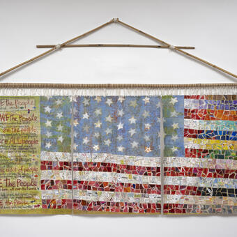 an American flag made from torn paper and to-do lists