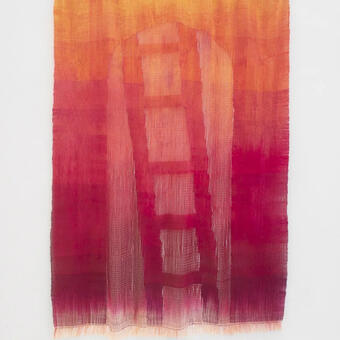 A handwoven wall hanging with a yellow to red gradient depicting an archway with a ladder.
