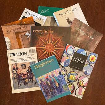 A fanned-out pile of colorful glossy literary magazines