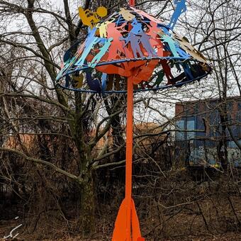 Access Art at Morrell Park Elementary Middle School Baltimore, laser cut images and welded steel, powder coated color, 17 ft x 6 ft diameter  2013, students posed for photographs that were then made into a predetermined umbrella shape.