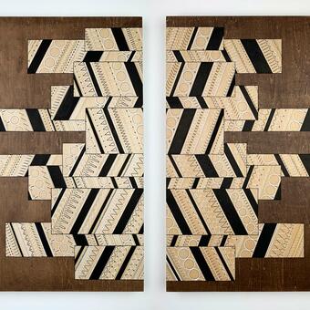 Geometric mirrored panel design on wood surface