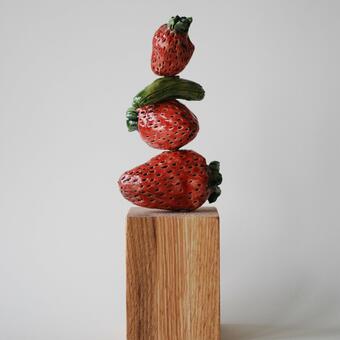 stacked strawberries and gherkin