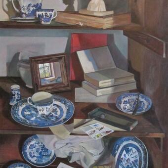 Still life with blue willow on a shelf 