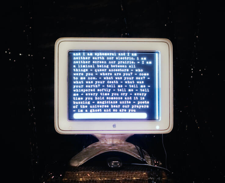 a poem is fills the entire screen of an an old mac computer.