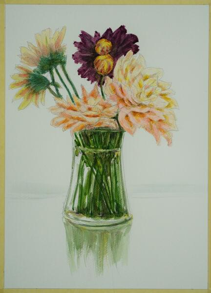 Flowers in a clear vase with reflection