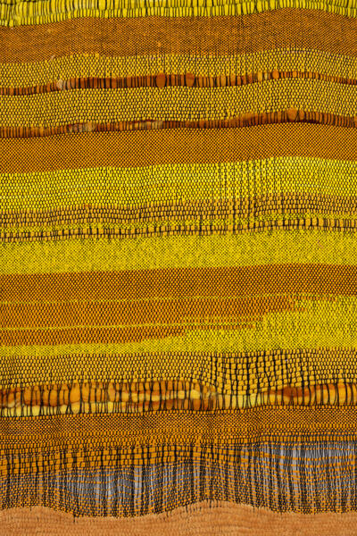 yellow weaving with a variety of textures