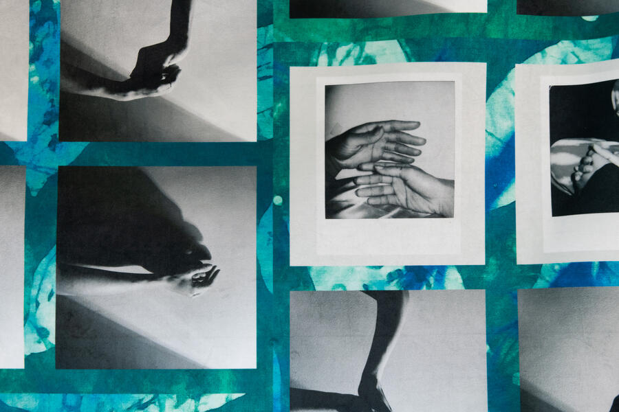 blue and green collage with black and white photograph of hands