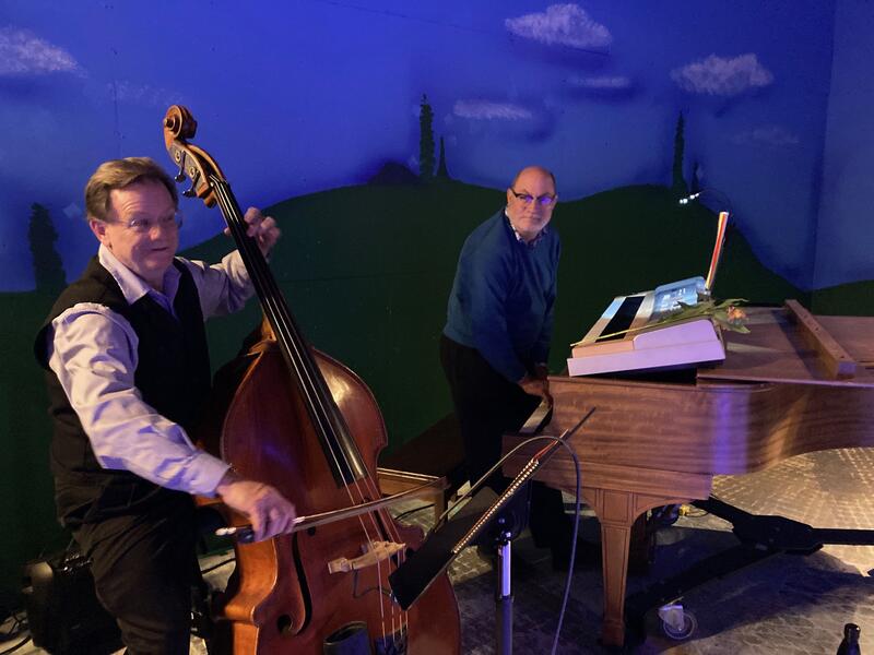 Dale Bohren on upright bass and Robert Hitz on piano and keyboard, on the set of A Midsummer Night’s Dream, where they created improvised music for the two-week run.