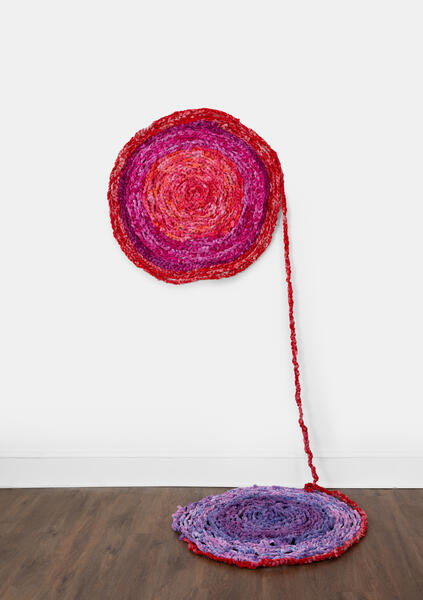 crocheted red, pink, and violet hand-dyed fabric