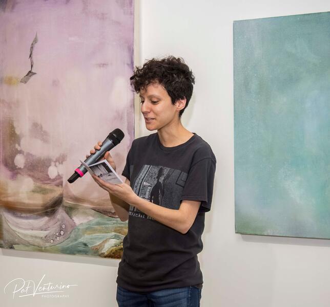 Reading during Whispers of Longing opening reception