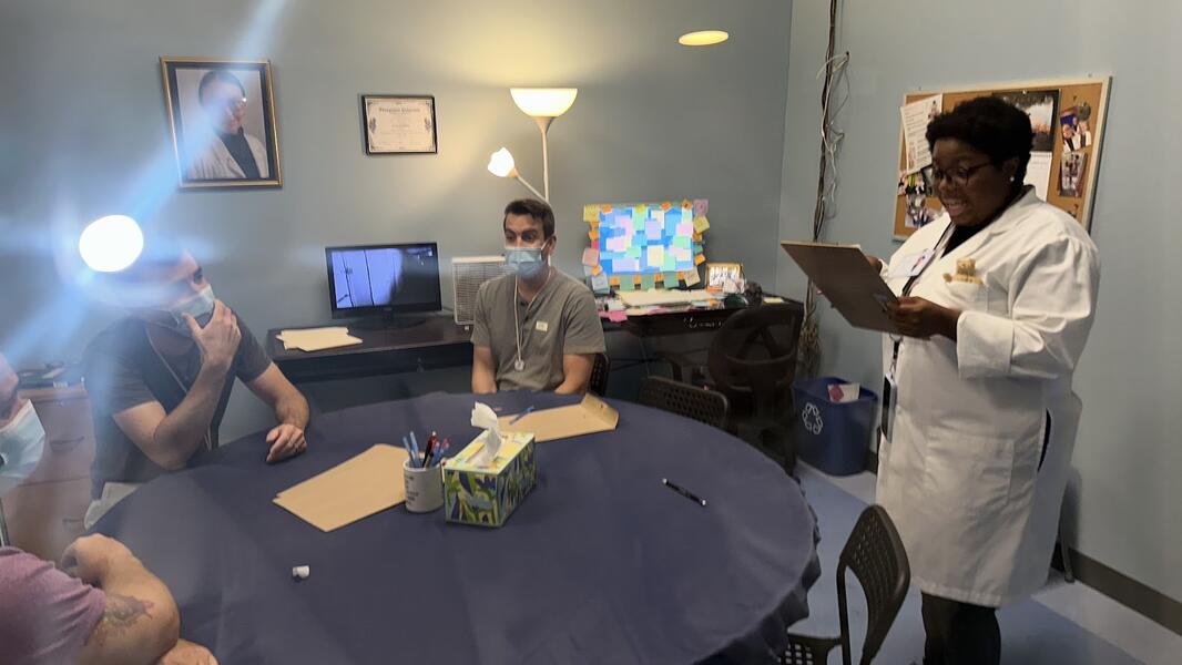 Audience and performers interact in the set of the Office in the Boundary.