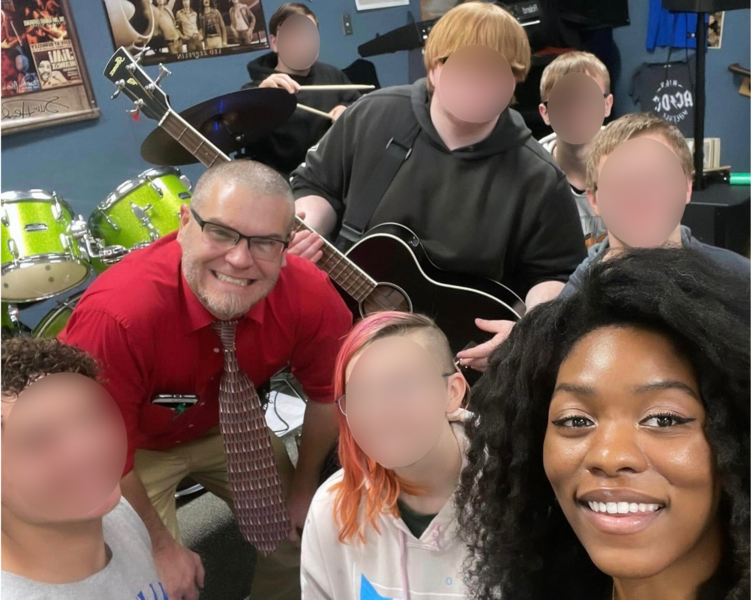 Evan Nicole Bell, band teacher Mr. Hoover, and North White students