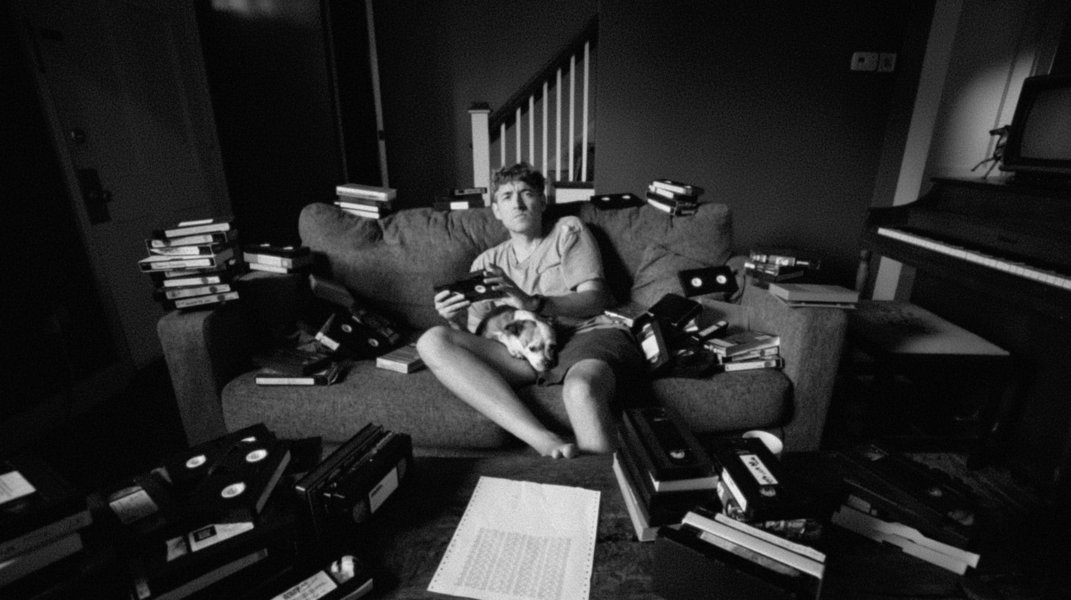 Conor and Sandy surrounded by VHS tapes