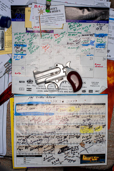 Calendar and a Derringer Pistol
