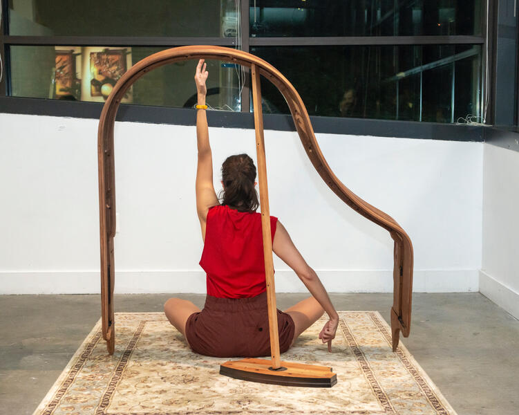 Still from performance of Garment/Gauge