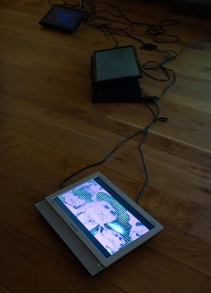 A glitched portrait of a General Motors executive opening the assembly line/plant in baltimore